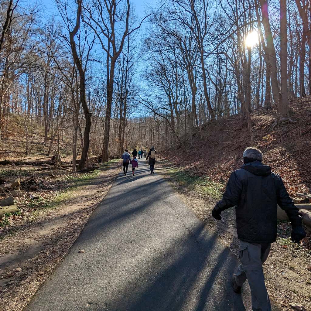 Participants at a Vernal Pool Guided Hike walk along the Trolley Trail in Ellicott City, Maryland.